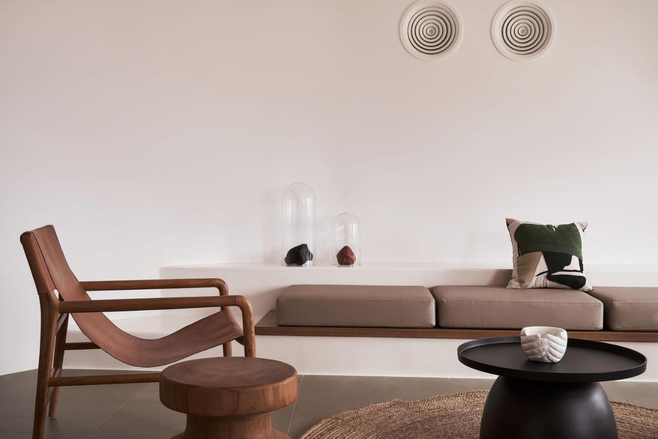 Orama Hotel & Spa Fira  Exteriör bild A living room with a sofa and a chair